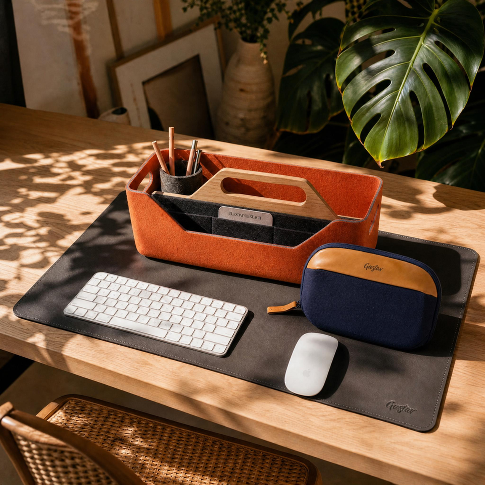 Desk setup with keyboard, mouse, and office supplies on a wooden desk.